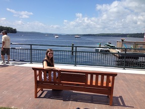Denie taking in a view on a Sebago Furniture Commemorative Bench along the Naples Causeway.